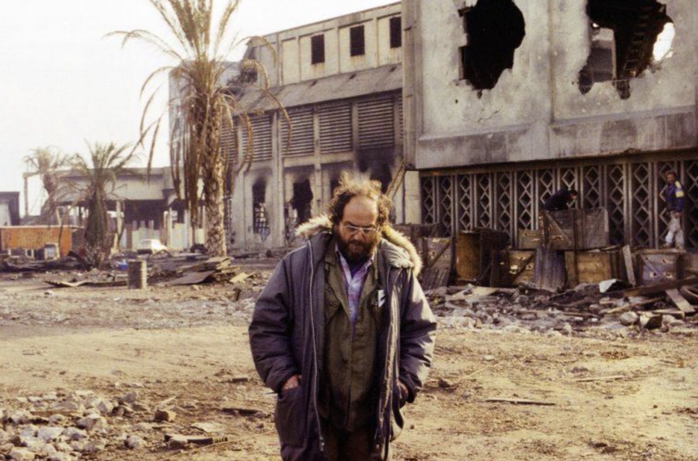 Stanley Kubrick walking alone on the set 